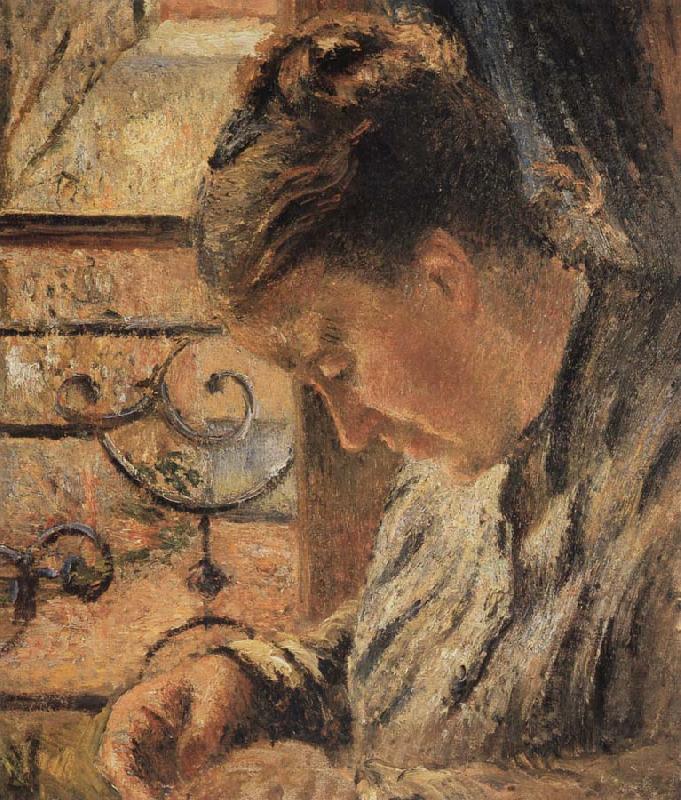 Camille Pissarro The Woman is sewing in front of the window